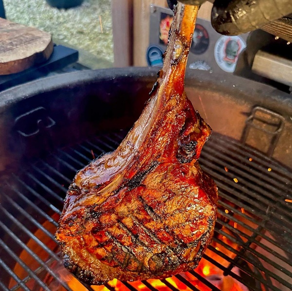 Pork chop cooking on BBQ